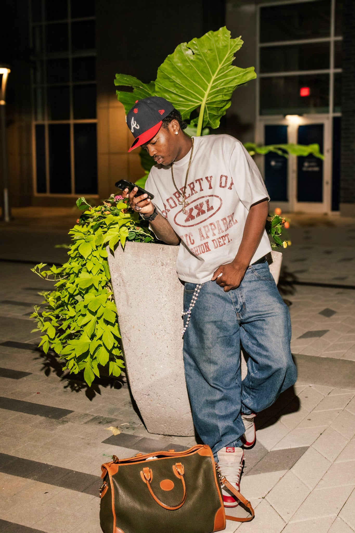 Red "Property of Xotic Apparel" tee