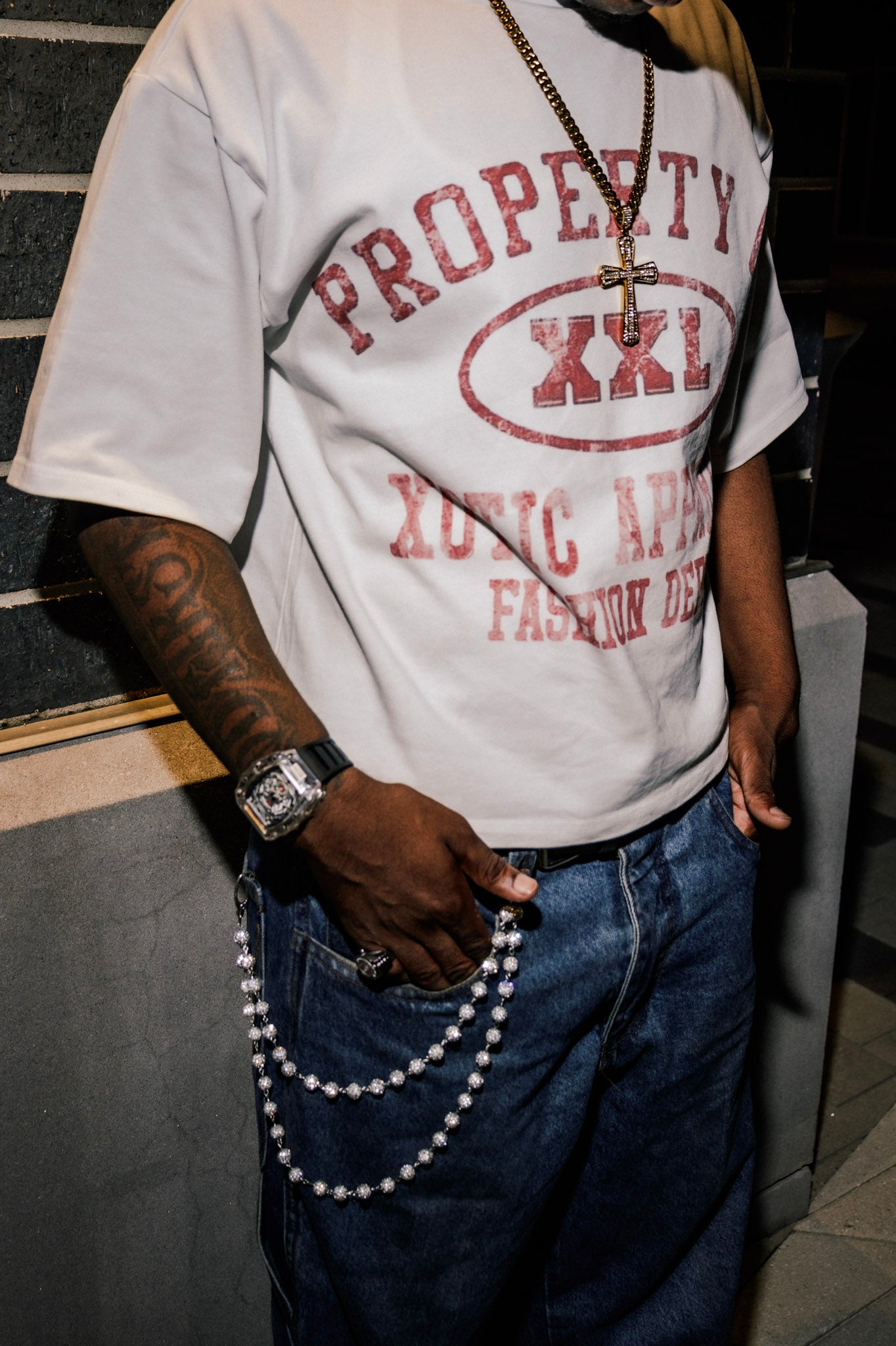 Red "Property of Xotic Apparel" tee