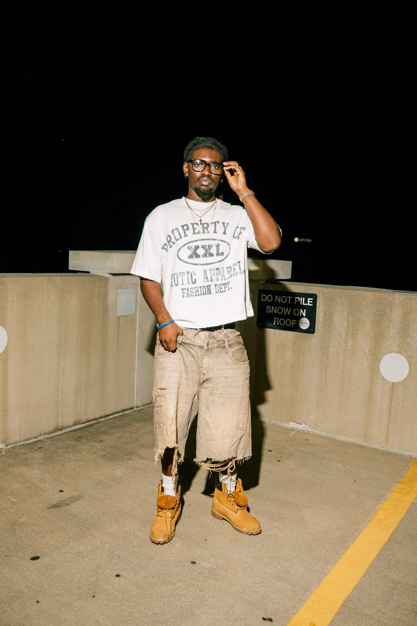 Black "Property of Xotic Apparel" tee