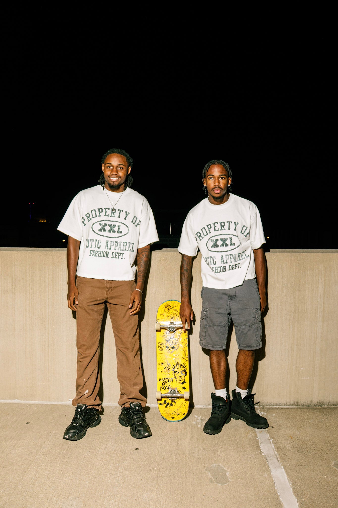 Black "Property of Xotic Apparel" tee