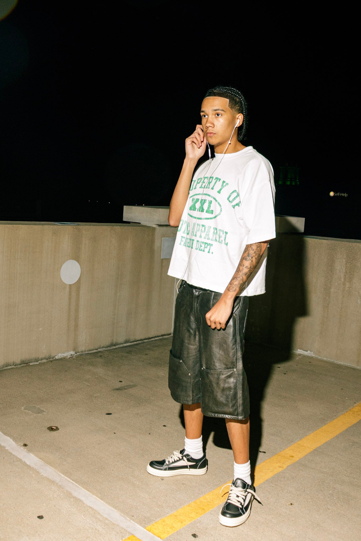 Green "Property of Xotic Apparel" tee